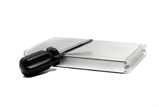 screwdriver and an external hard drive - Photo, Image
