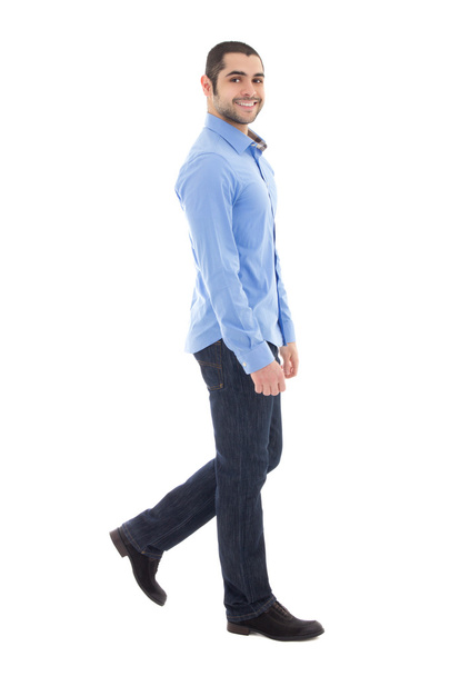 Side view of young arabic bearded business man in blue shirt wal - Fotoğraf, Görsel