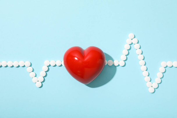 Heart with a cardiogram on a light background. - Photo, Image