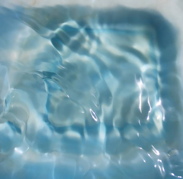 Small waves surface of blue colored water - Photo, Image