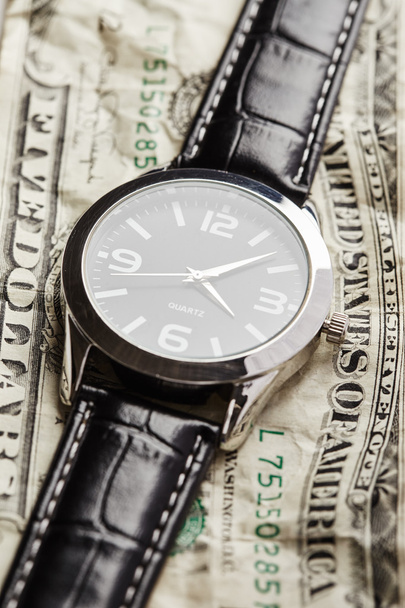 Dollar mit Uhr - Foto, Bild