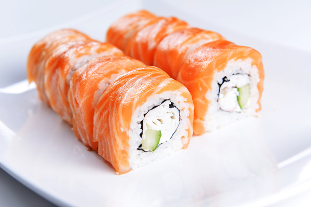 Sushi with salmon on plate - Fotoğraf, Görsel