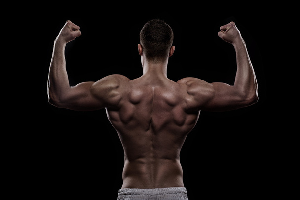 young athlete bodybuilder from back - 写真・画像