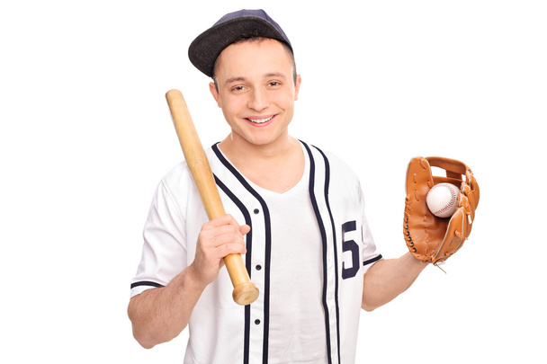 Man holding baseball bat and a ball - Zdjęcie, obraz