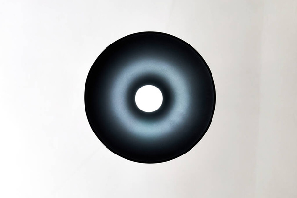 bottom view of a led lamp with a black shade on a white background - Photo, Image