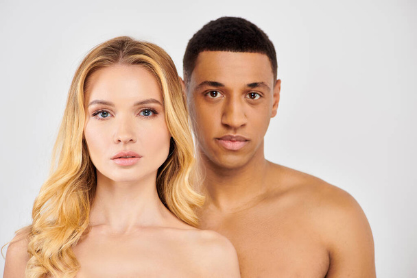 attractive man and woman pose against a white backdrop. - Photo, Image