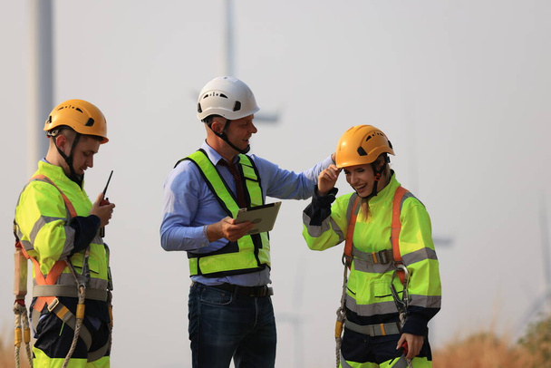 Wind turbine manager and technician work audit, service or maintenance, Green and renewable energy concept  - Photo, Image