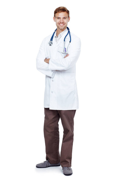 Man, doctor and happy in studio for health care on white background, smile and satisfied with career. Medical professional, portrait and confident on job, growth and support as cardiologist - Photo, Image