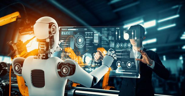 Механизированный промышленный робот и человек-рабочий работают вместе на будущем заводе. Концепция искусственного интеллекта для промышленной революции и процесса автоматизации производства. - Фото, изображение