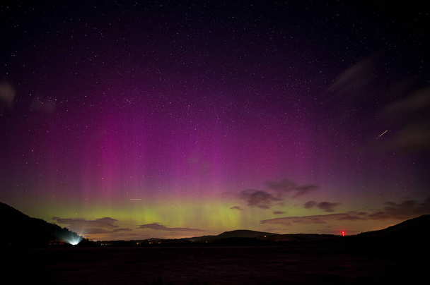 A stunning display of the northern lights over Bassenthwaite lake in the English Lake District - Photo, Image