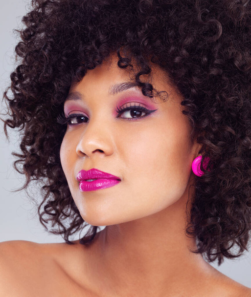 Makeup, beauty and portrait for woman, haircare and cosmetics on studio background. Cosmetic, face and pink lipstick with curly hairstyle for happy African female model, cosmetology and closeup. - Photo, Image