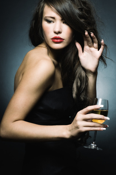 Beautiful sexy woman with a glass of white wine - Foto, imagen