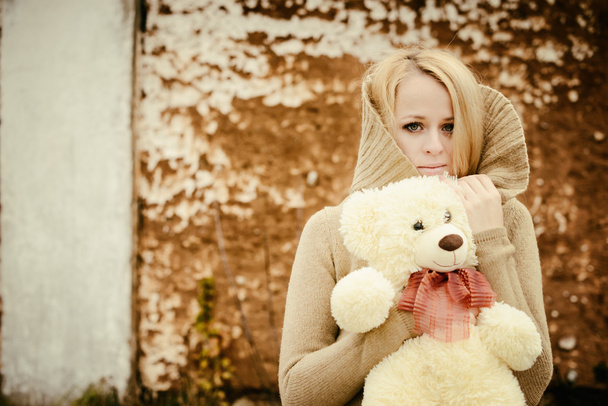 young sensual girl blonde in windy fall with toy - Foto, Imagen
