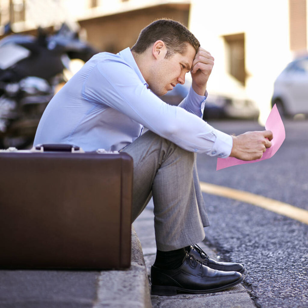 Businessman, worry or job loss in street with letter, stress or thinking of career crisis. Salesman, pink slip or mental health or anxiety of work performance or fired with termination of contract. - Photo, Image