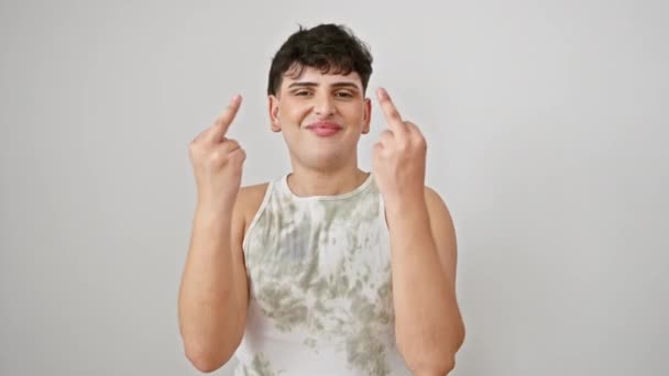 Excited young man in sleeveless t-shirt making bold 'fuck you' hand sign. standing against an isolated white background, showing attitude and provocation. - Materiaali, video