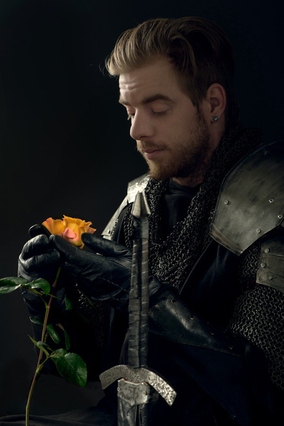 Ancient knight with yellow rose - 写真・画像