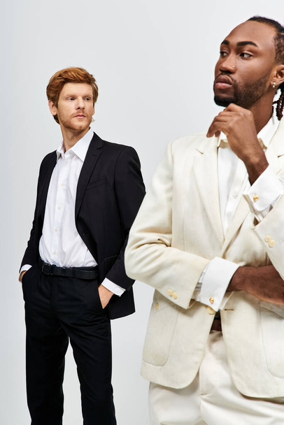 Two multicultural men in stylish suits standing side-by-side. - Photo, Image