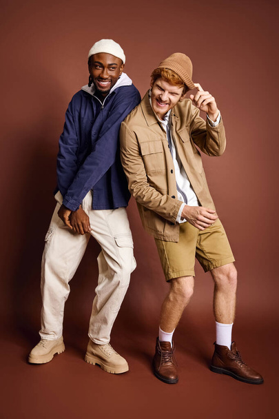 Multicultural men with stylish attire pose together for a picture. - Photo, Image