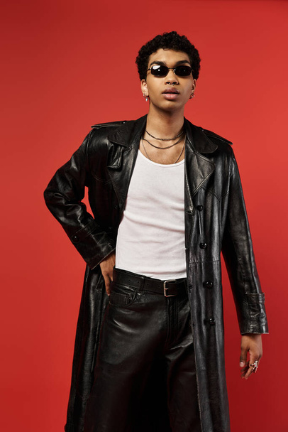 Young man in leather coat striking a pose - Photo, Image