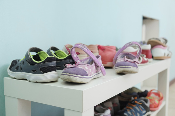 shoe shelf with children shoes - Zdjęcie, obraz