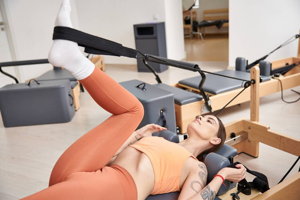 Athletic woman on a pilates lesson. - Photo, Image
