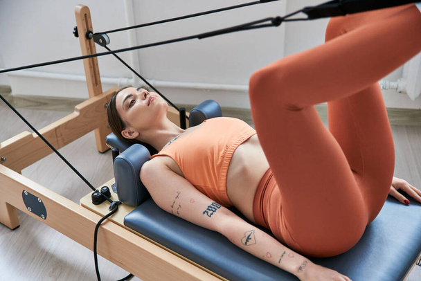Fit woman on a pilates lesson. - Photo, Image