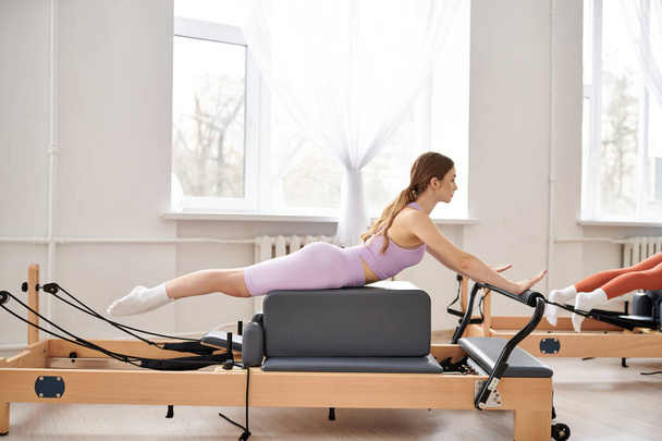Fit woman exercising during a pilates lesson. - Fotografie, Obrázek