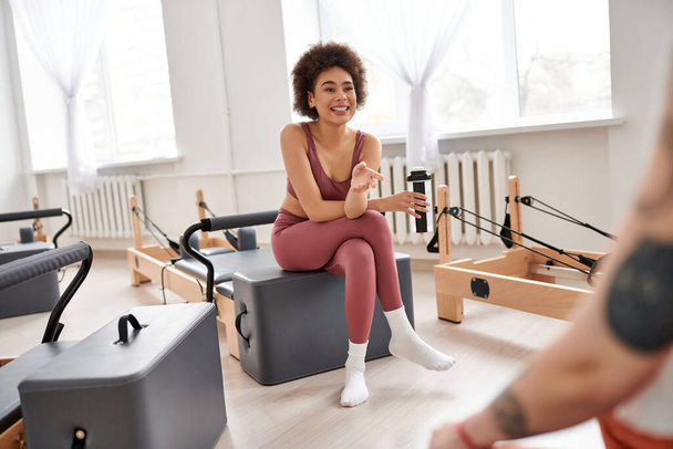 Beautiful women spending time together on pilates lesson in gym, relaxing. - Photo, Image