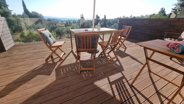 table chairs wooden in wooden balcony with gllass for summer vaccation  tourist place - Photo, Image