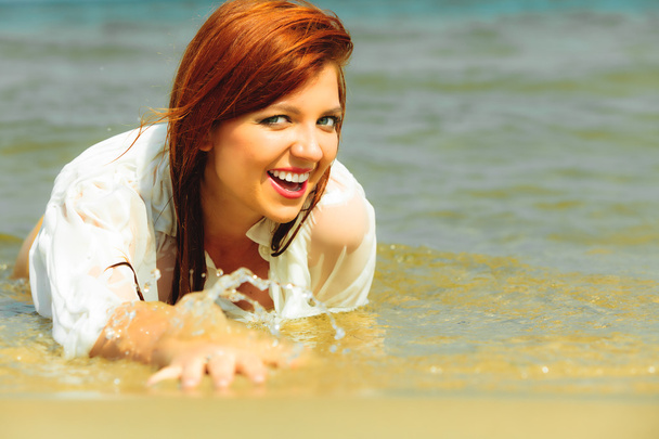 Vacation. Girl in water having fun on the sea. - Foto, afbeelding