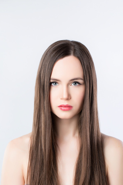 Brunette with long straight hair.  - Фото, изображение