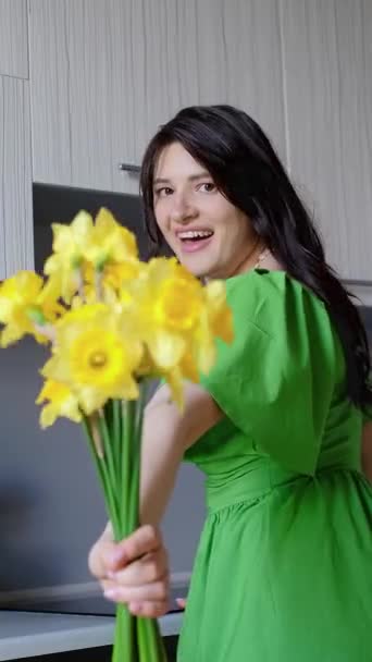 Woman holding out bouquet, evoking pleasant emotions and feelings stirred by the scent of fresh flowers. - Footage, Video