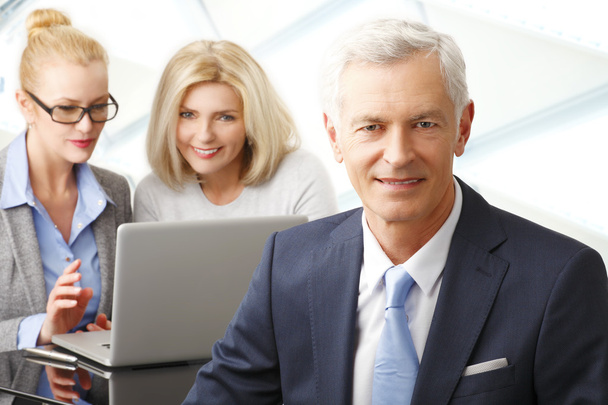 Businessman with women on background - Photo, Image