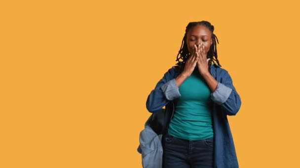 African american woman covering eyes, ears and mouth with hands, imitating the three wise monkeys. Girl doing do not see, do not hear and do not speak gesturing concept, studio background, camera B - Footage, Video