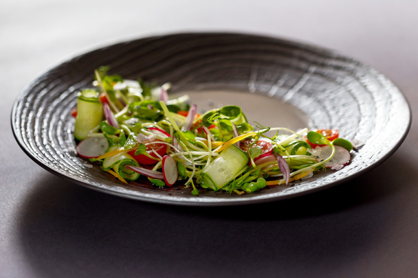 Authentic fresh vegetable salad with sprouts and peas black pepp - 写真・画像