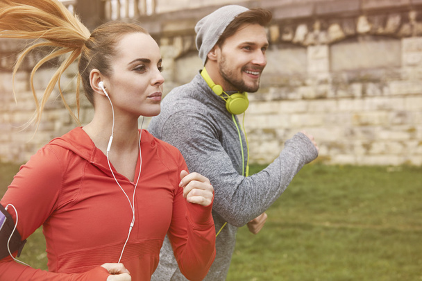 Fitness couple jogging outdoors - Valokuva, kuva