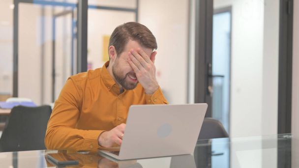 Young Man having Headache at Work - Photo, Image