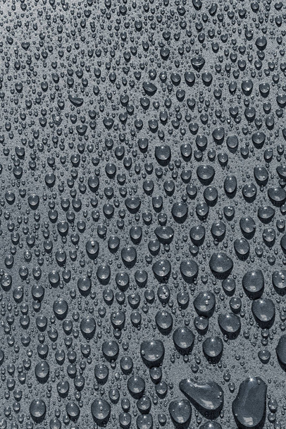 Капли воды на грубой поверхности, текстурный фон - Фото, изображение