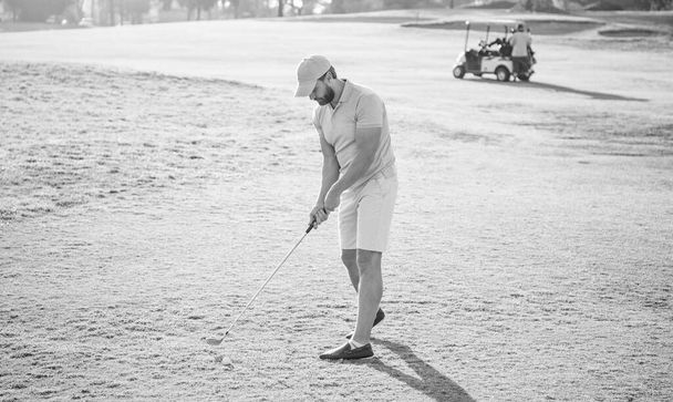 golfer in cap with golf club stand on grass, hobby. - Photo, Image