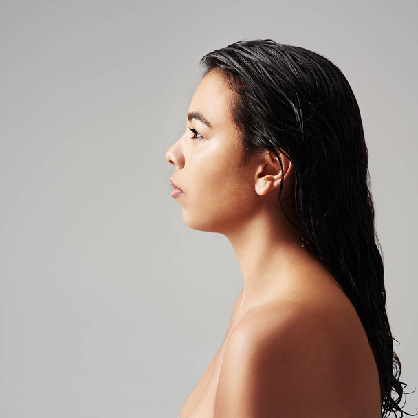 Woman, profile and beauty with haircare, cosmetics or salon on a gray studio background. Young female person or model with wet hair or shower in spa wash, hygiene or keratin treatment on mockup space. - Photo, Image