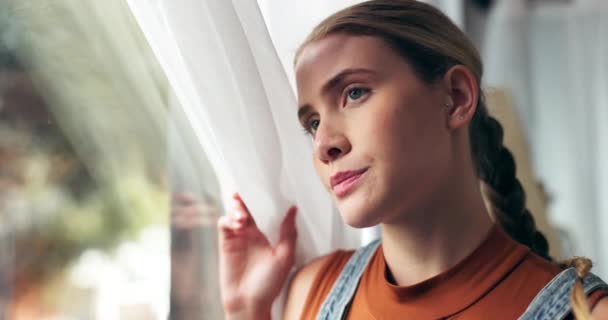 Girl, thinking and window in home with anxiety, memory or decision for studying, debt or education. Woman, person or student with vision, reflection or stress for exam results by curtains in house. - Footage, Video