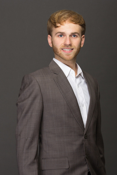 young businessman smiling wearing casual suit - Fotografie, Obrázek