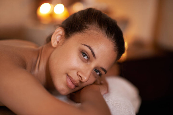 Portrait, wellness and woman in spa to relax for vitality or wellbeing, luxury and pamper for body care or treatment. Female person, resort and calm or carefree for stress relief, peace and therapy - Photo, Image