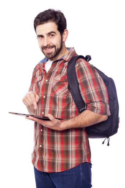 Smiling student holding a tablet pc - Foto, imagen