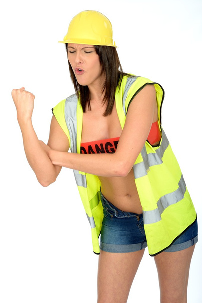 Сексуальная молодая женщина позирует топлесс в одежде строителей
 - Фото, изображение