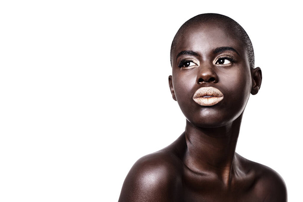 Mockup for black woman, thinking or makeup with lipstick, cosmetics or beauty space in studio. Gold color, bald head or African girl model with glow, eyeshadow or skincare results on white background. - Photo, Image