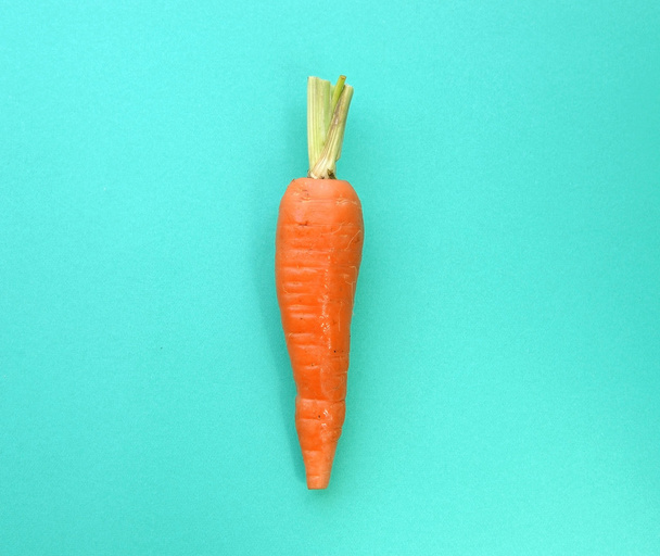 Carrot on blue background - Foto, Imagem