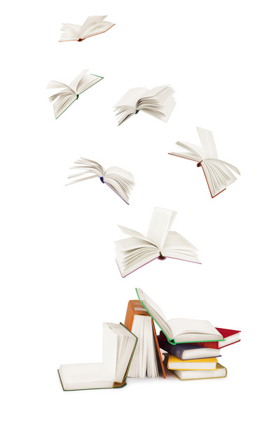 Stack of  books and flying books isolated on white - Фото, изображение