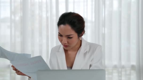 Stressful businesswoman looking at debt bill invoice notification, faces bankruptcy due to overwhelming debt, expenses and economic crisis from bad corporate financial and loan pay management. Vivancy - Footage, Video