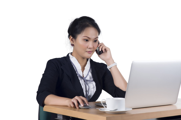 Portrait of business woman speaking on mobile phone while using  - Photo, image